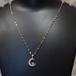Half moon diamond pendant and braided chain
