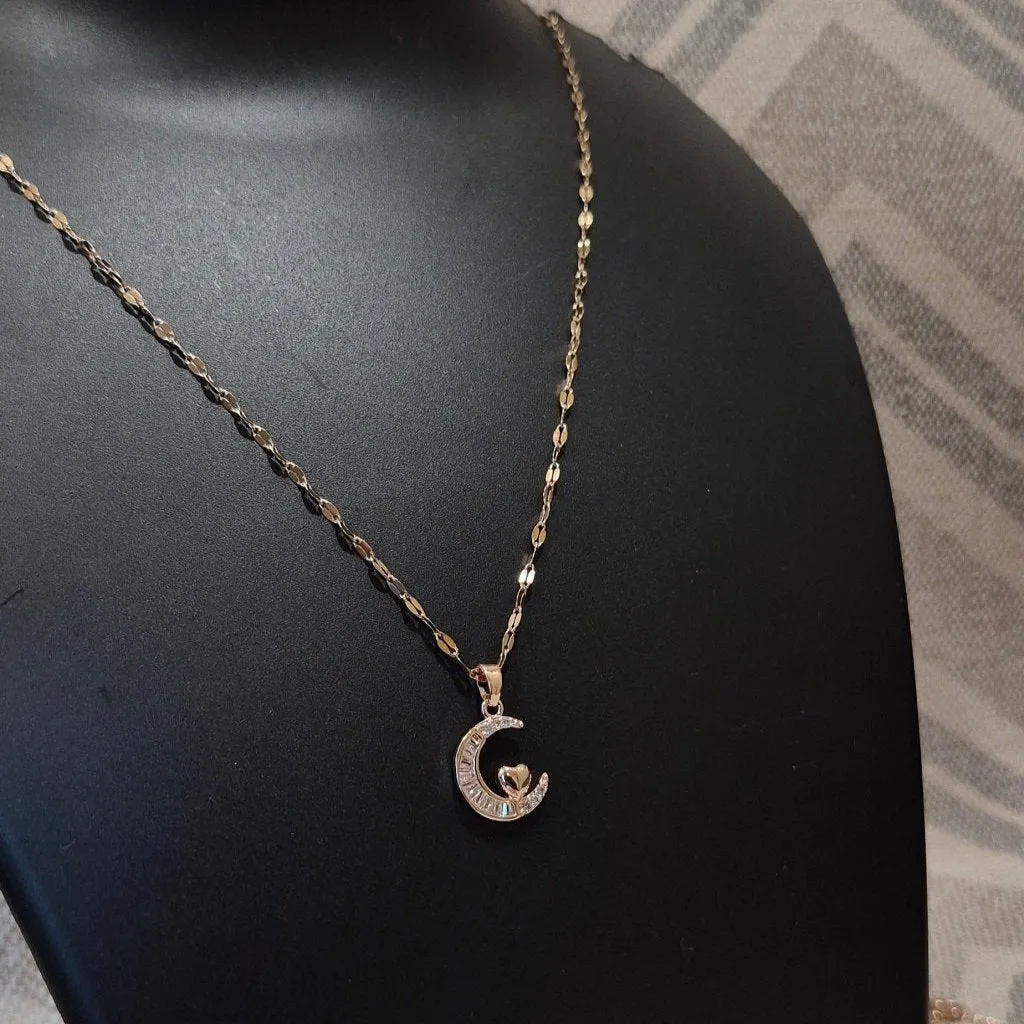 Half moon diamond pendant and braided chain