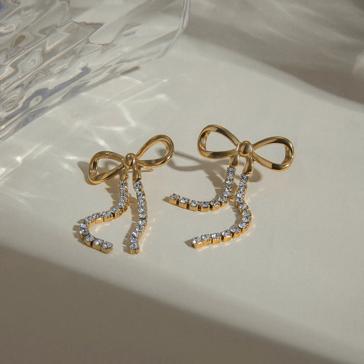 Rhinestone chain earrings with bow